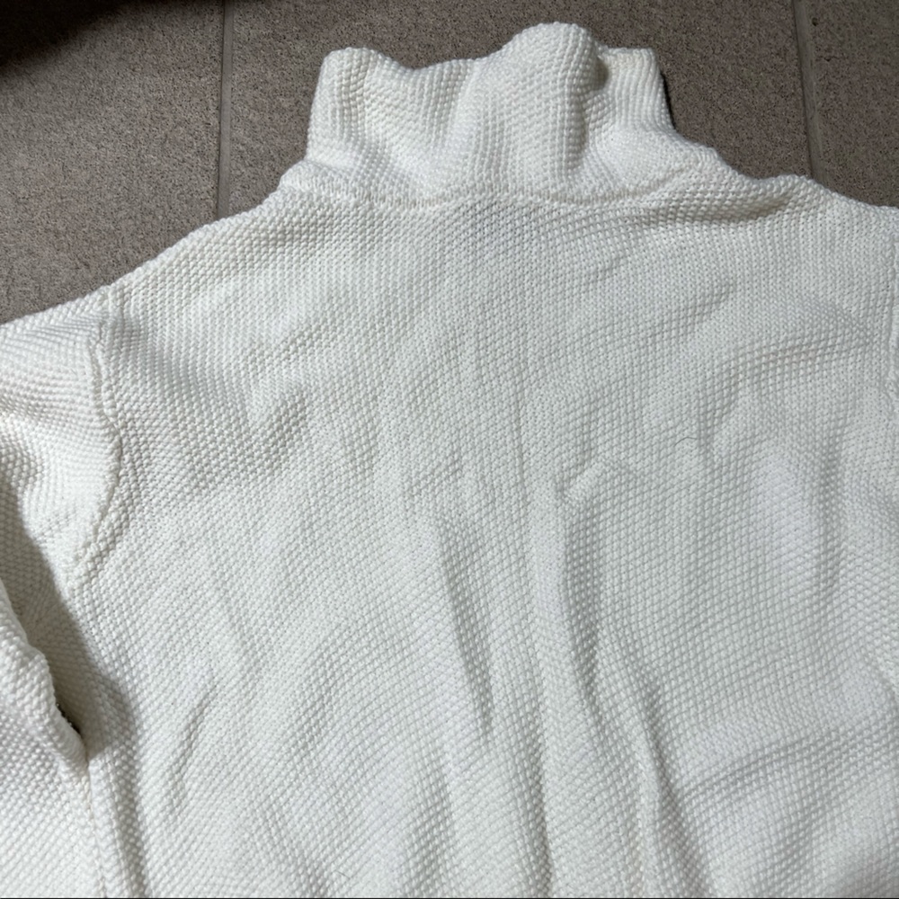 white cropped turtle neck sweater with bell sleeves